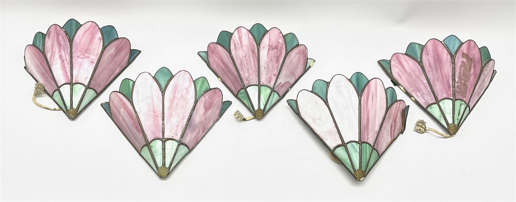 Five Tiffany style pink and blue leaded glass wall lights, approximately H23.5cm. 