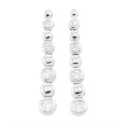 Pair of 18ct white gold round brilliant cut diamond stud earrings, Sheffield 2002, total diamond weight approx 0.25 carat