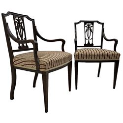 Edwardian mahogany framed three-piece salon suite - two-seat sofa, stepped cresting rail over acanthus and scroll carved pierced splat, upholstered in striped fabric (W124cm, H87cm, D62cm); and a pair of matching armchairs (W60cm) 