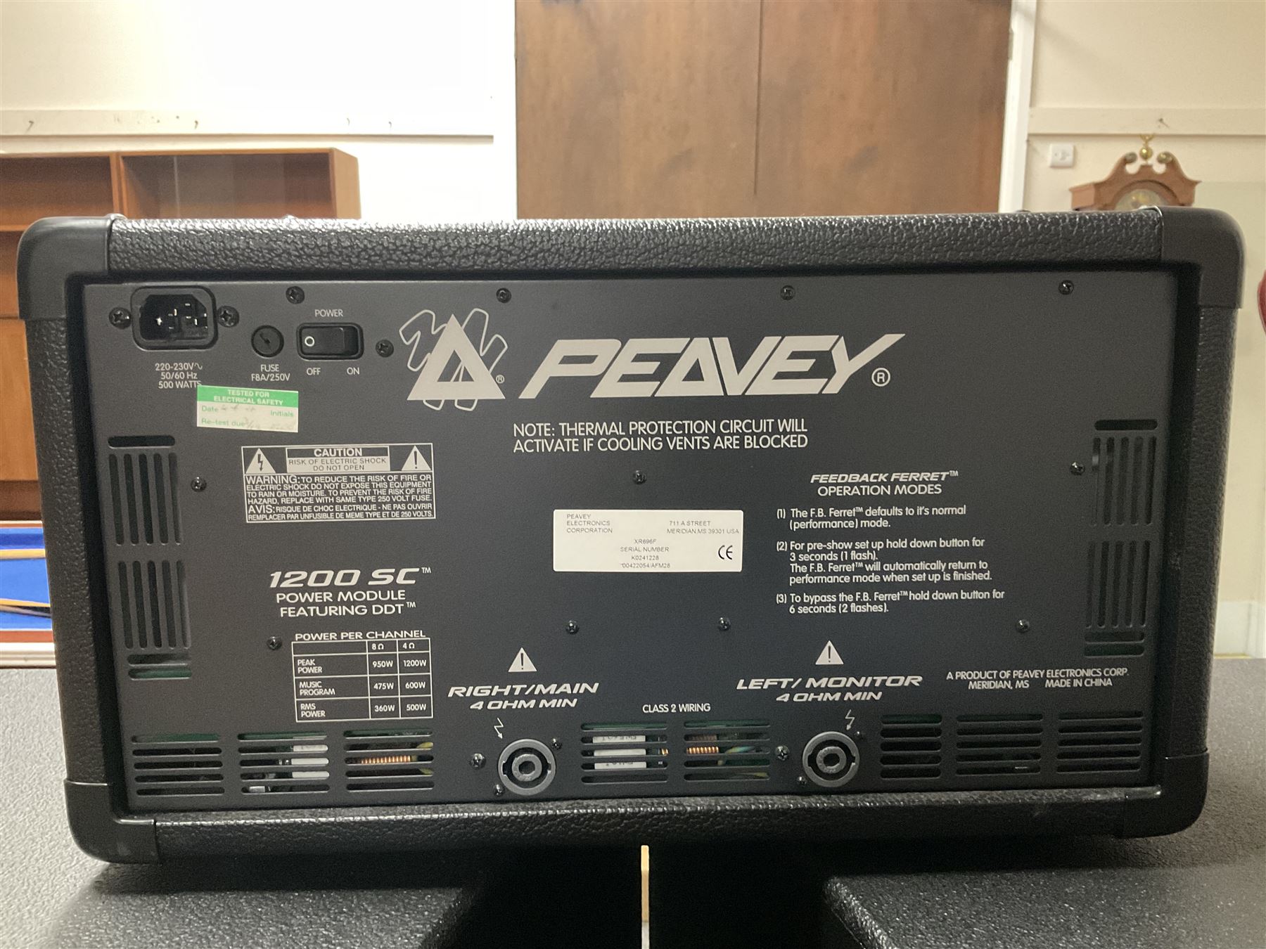 Peavey XR-696F 1200W Amplifier, serial no.K0241228, L47cm; with two Peavey UL bass bins L56cm and two Peavey top speakers L45cm with connecting rods; all with covers; and quantity of heavy duty cables, two microphone cables and microphone stand