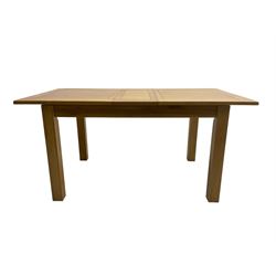 Light oak extending dining table, rectangular top with rounded corners raised on square supports, with additional leaf