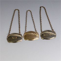 Five silver decanter labels, of varying design, including Bacardi, Vodka, Rum, Brandy and Whisky, all hallmarked together with two silver plated Gin and Sherry examples