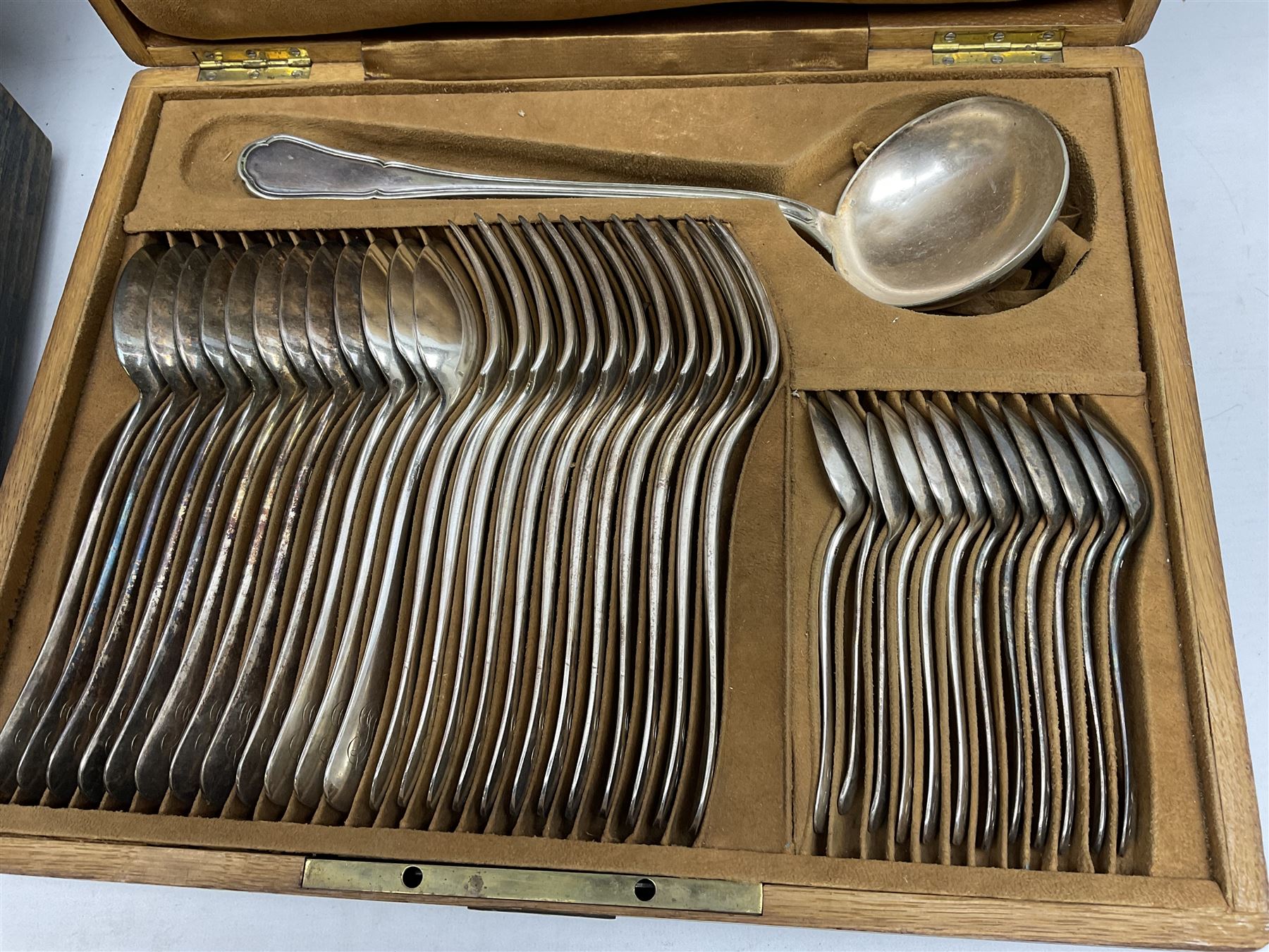 De Montfort cased canteen of silver plated cutlery for six place settings, together with further cased canteen of spoons and forks stamped Bon Marche