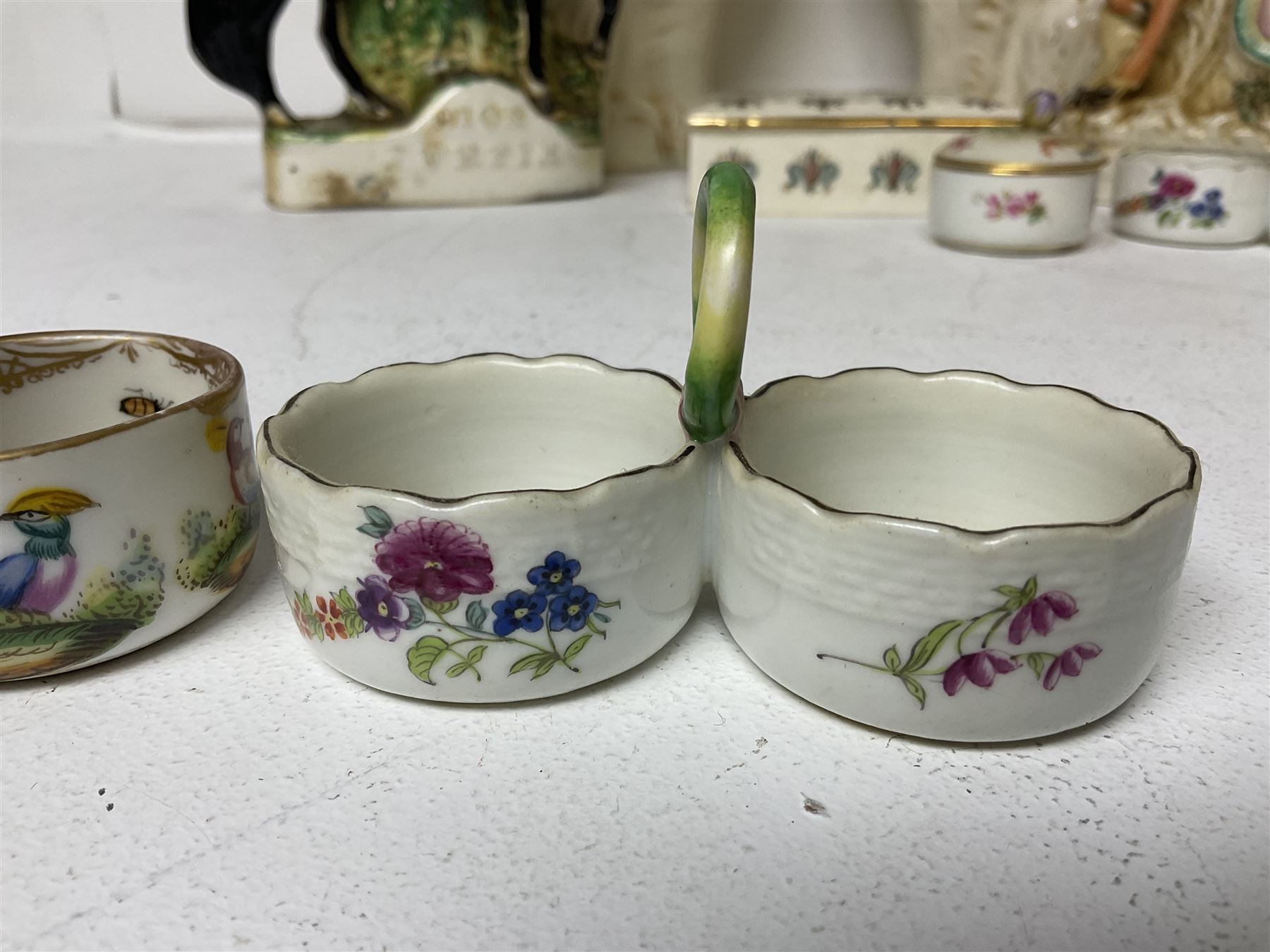 Staffordshire figure of the Duke of Wellington on a bay horse, H30cm in red uniform, together with a similar Staffordshire figure of Dick Turpin, pair of Staffordshire style dogs, H27cm, three Meissen style double salts and two trinket boxes 