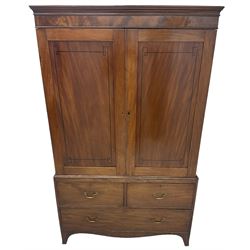 19th century mahogany linen press, projecting moulded cornice over figured frieze, enclosed by two panelled doors with geometric stringing, fitted with two short and one long cock-beaded drawers, on shaped apron and splayed bracket feet