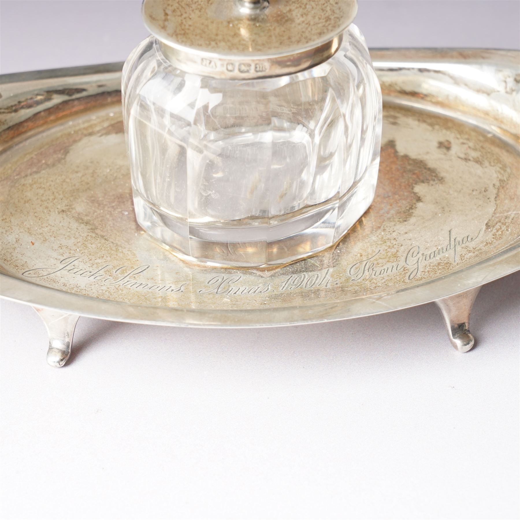 Edwardian silver navette shape inkstand with silver mounted glass inkwell, presentation inscription and splay feet L20cm Sheffield 1904 Maker Atkin Bros