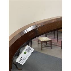 Early 19th century mahogany cheval dressing mirror, plain mirror plate within chamfered frame with arched top, on rolled horns and out-splayed rolled feet, united by turned stretcher 