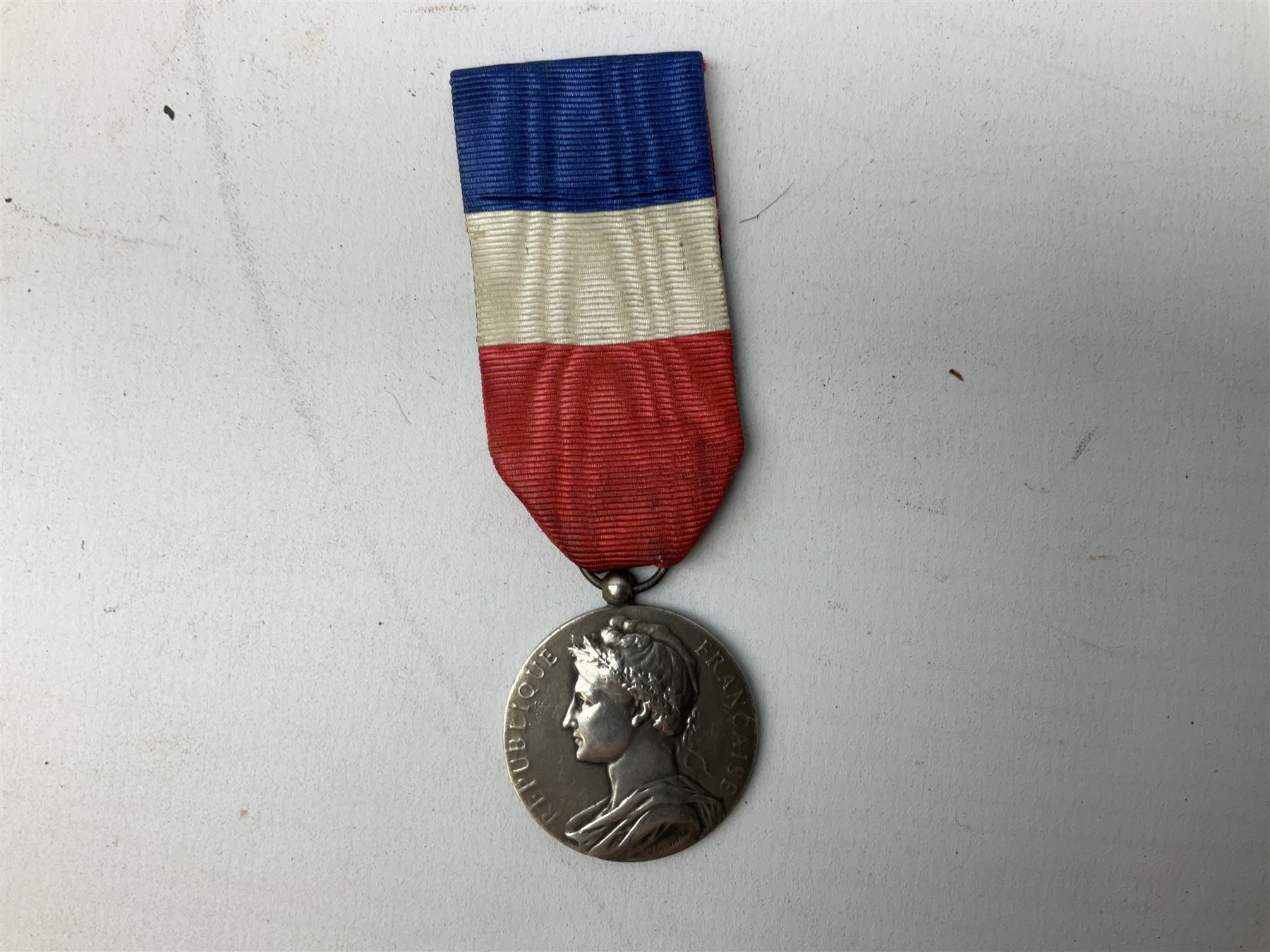 Five continental medals - WW1 Belgian Cross of Fire; WW1 French Croix De Guerre; French Croix De Combattant; French Republic Workers silver merit awarded to L. Mounet 1950; and boxed French Palmes Universitaires Officier d'Academie silver and enamel wreath (5)