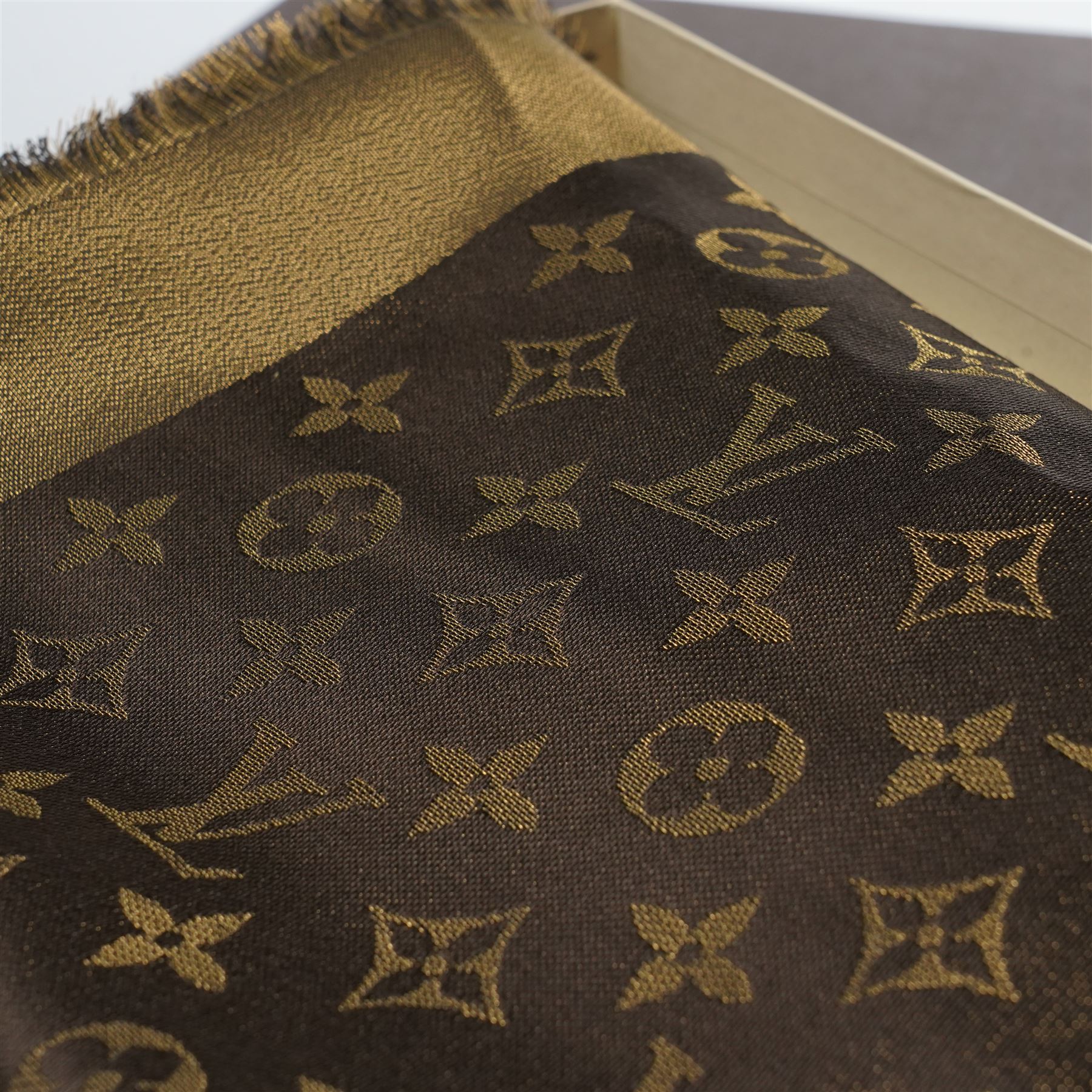 Louis Vuitton – a monogram silk and wool blend shawl in brown and gold, with fringe, 140cm x 140cm, unused with original box