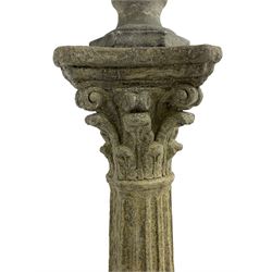 Classical design cast stone female bust depicting Artemis, raised on fluted Corinthian column with acanthus leaf capital, stepped square base, looking right 
