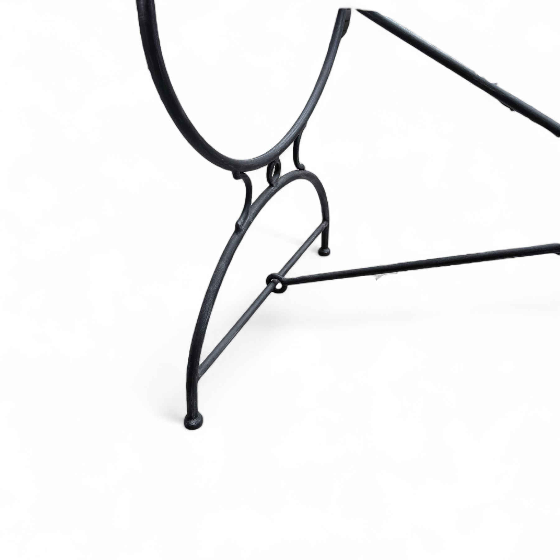 Wrought steel rectangular conservatory dining table, with glass top; and six, four side and two armchairs, with lattice backs and X framed bases, loose cushions