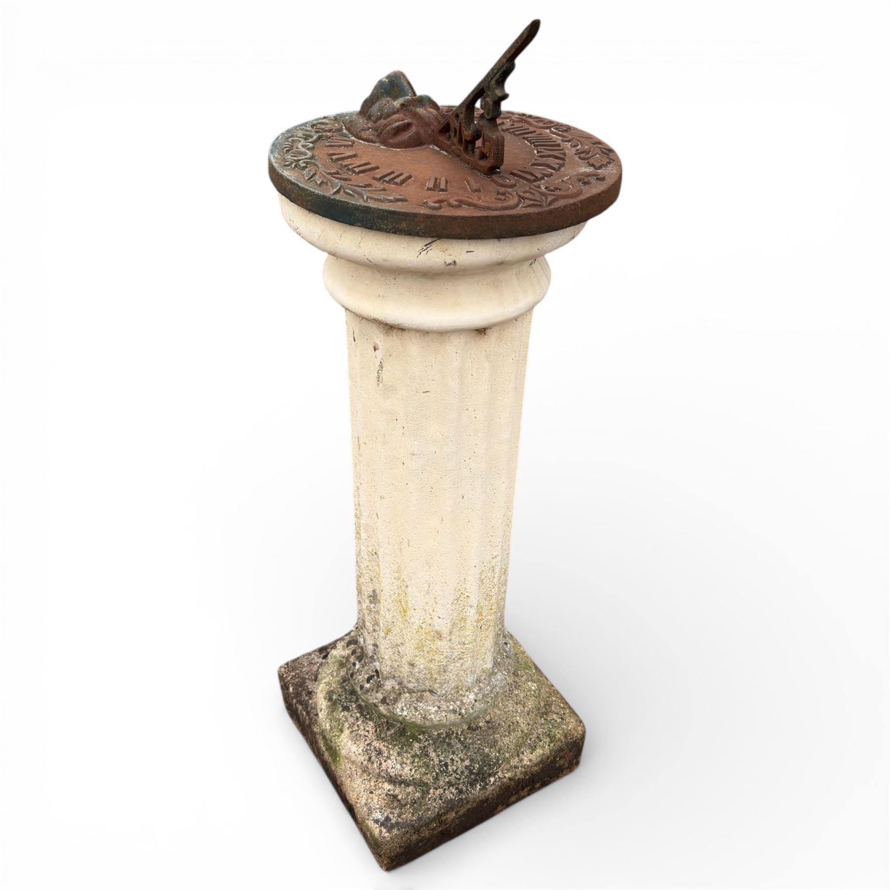 Cast stone garden sundial featuring a cast iron top with Roman numerals and lions head motif