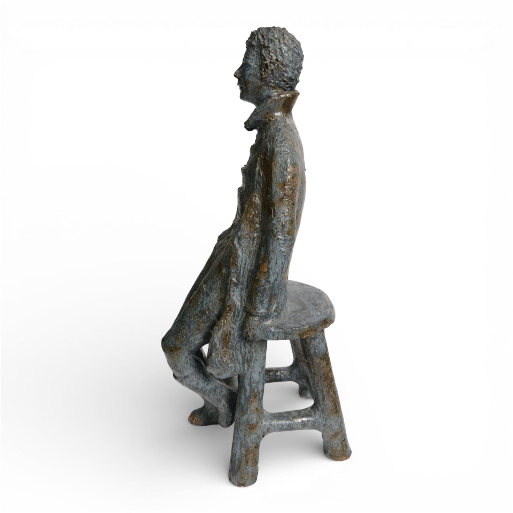 Studio pottery figure, modelled as a boy seated upon a stool, H68cm 
