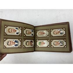 Three albums of cigarette cards including Wills Recruiting Posters, Military Motors and Allied Army Leaders, cricketers etc; another album containing a large quantity of laid-in cigarette cards; and an album of thirty-seven postcards of dogs by Mac (5)