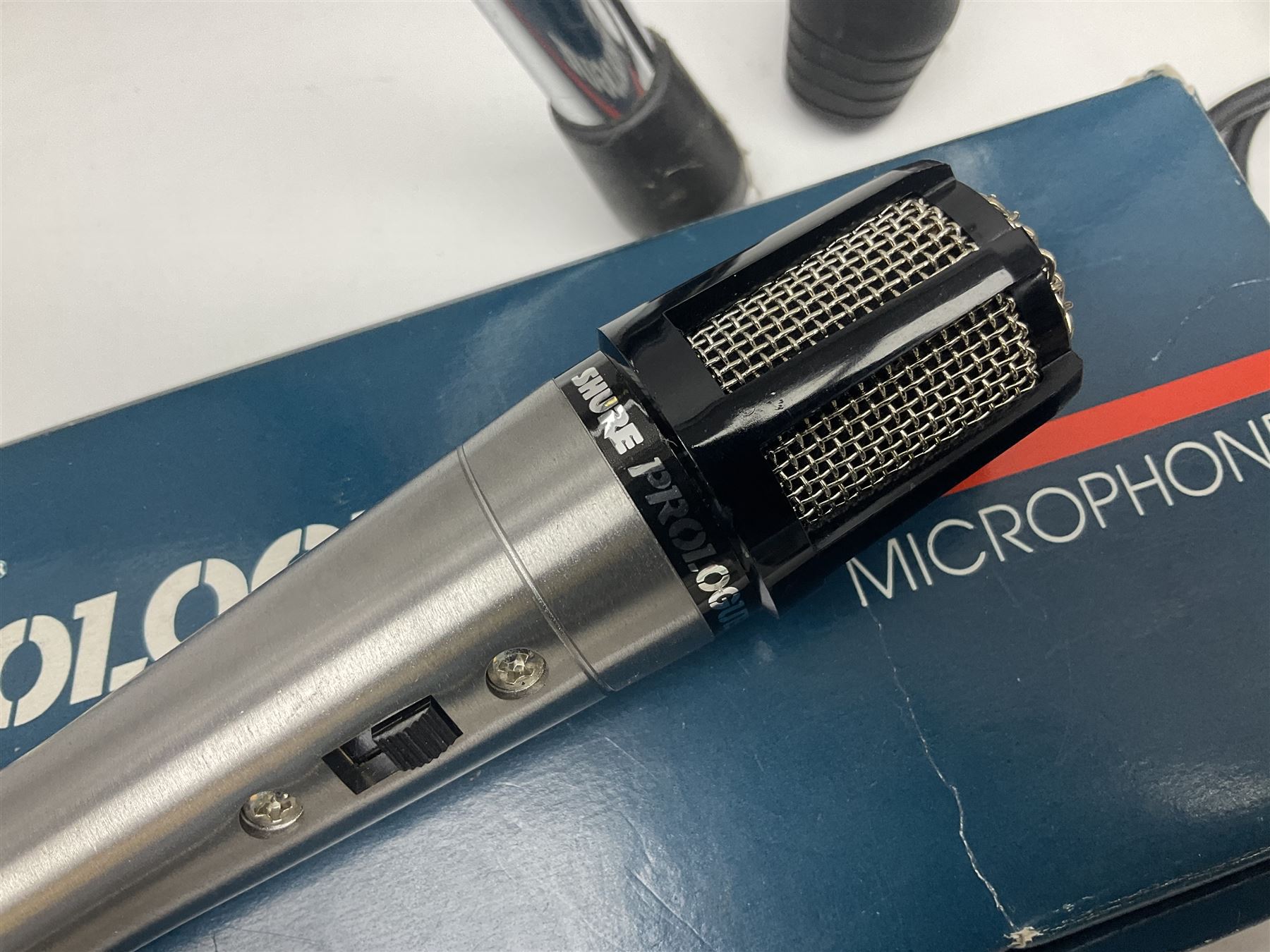 Shure SM58 Dynamic microphone; in original bag with paperwork; Shure Prologue 10H-LC Dynamic microphone; boxed; each with cable and tubular chrome adjustable stand (4)