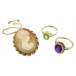 Gold peridot ring, gold amethyst ring and a gold cameo brooch, all hallmarked 9ct 