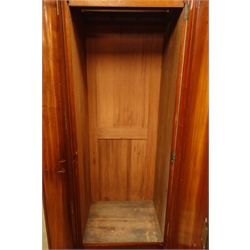  Victorian mahogany triple wardrobe, centre mirror glazed door, two arched panelled doors, fitted with drawers and linen slides, plinth base, W212cm, H208cm, D68cm  