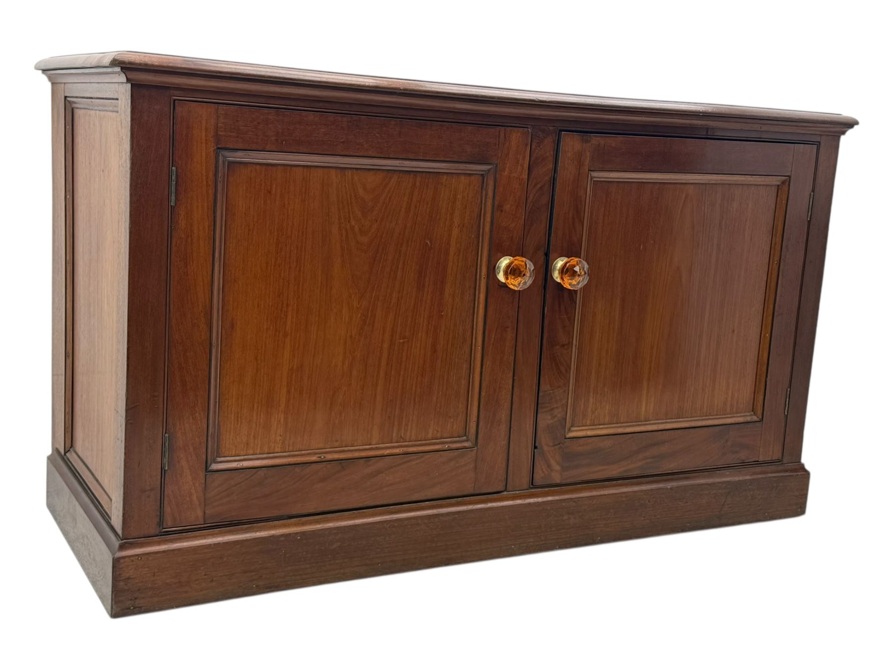 Victorian mahogany cupboard, plain rectangular top above two fielded panel doors opening to shelved interior, raised on a moulded plinth base, with later replacement knob handles