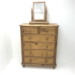 Solid pine chest fitted with two short and four long drawers, turned supports (W98cm, H121cm, D51cm) with pine framed swing mirror 