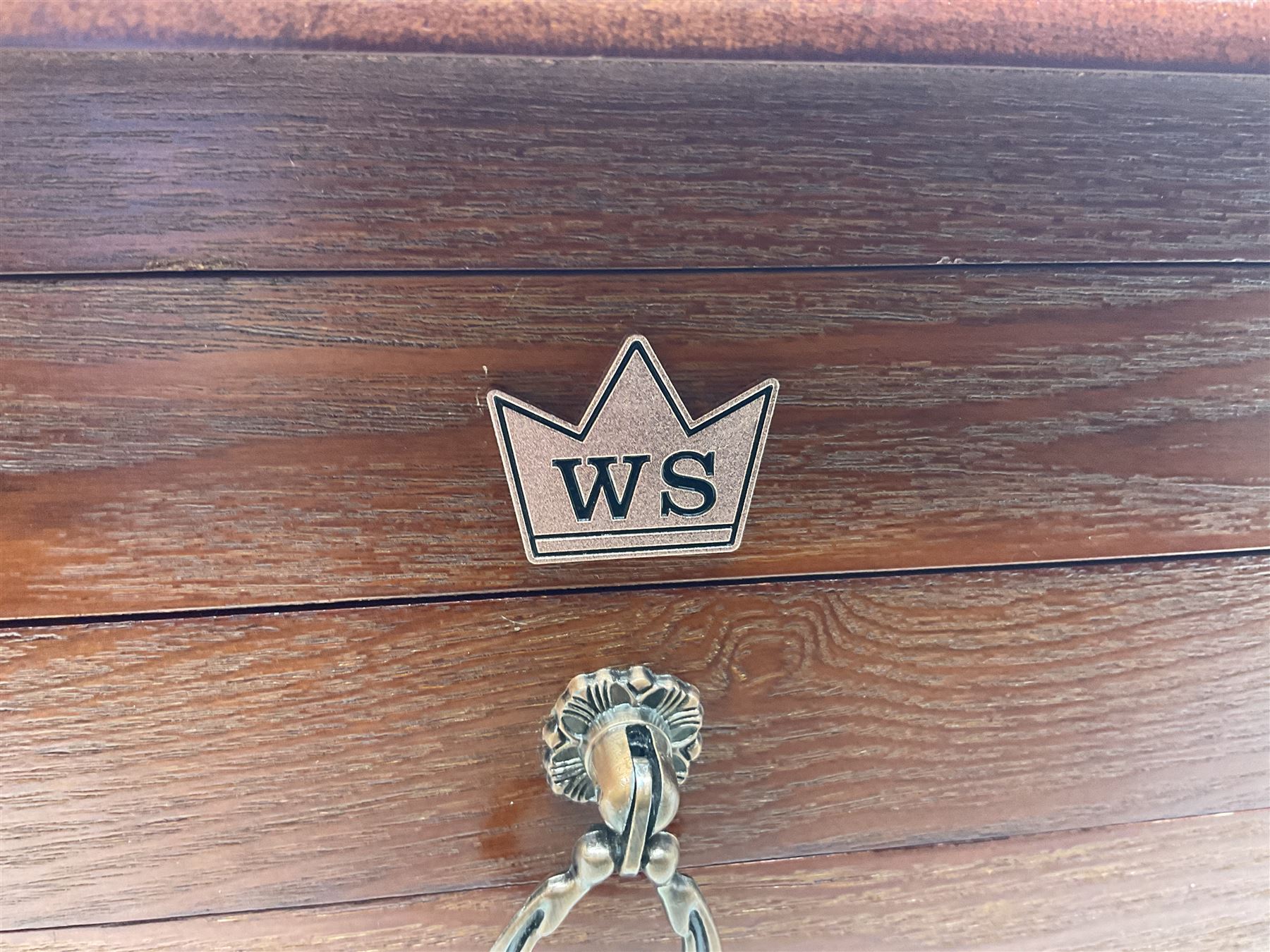 Waltmann und Sohn part canteen of stainless steel and gilt cutlery, the stained wood case with hinged lid above two fitted drawers, L48cm