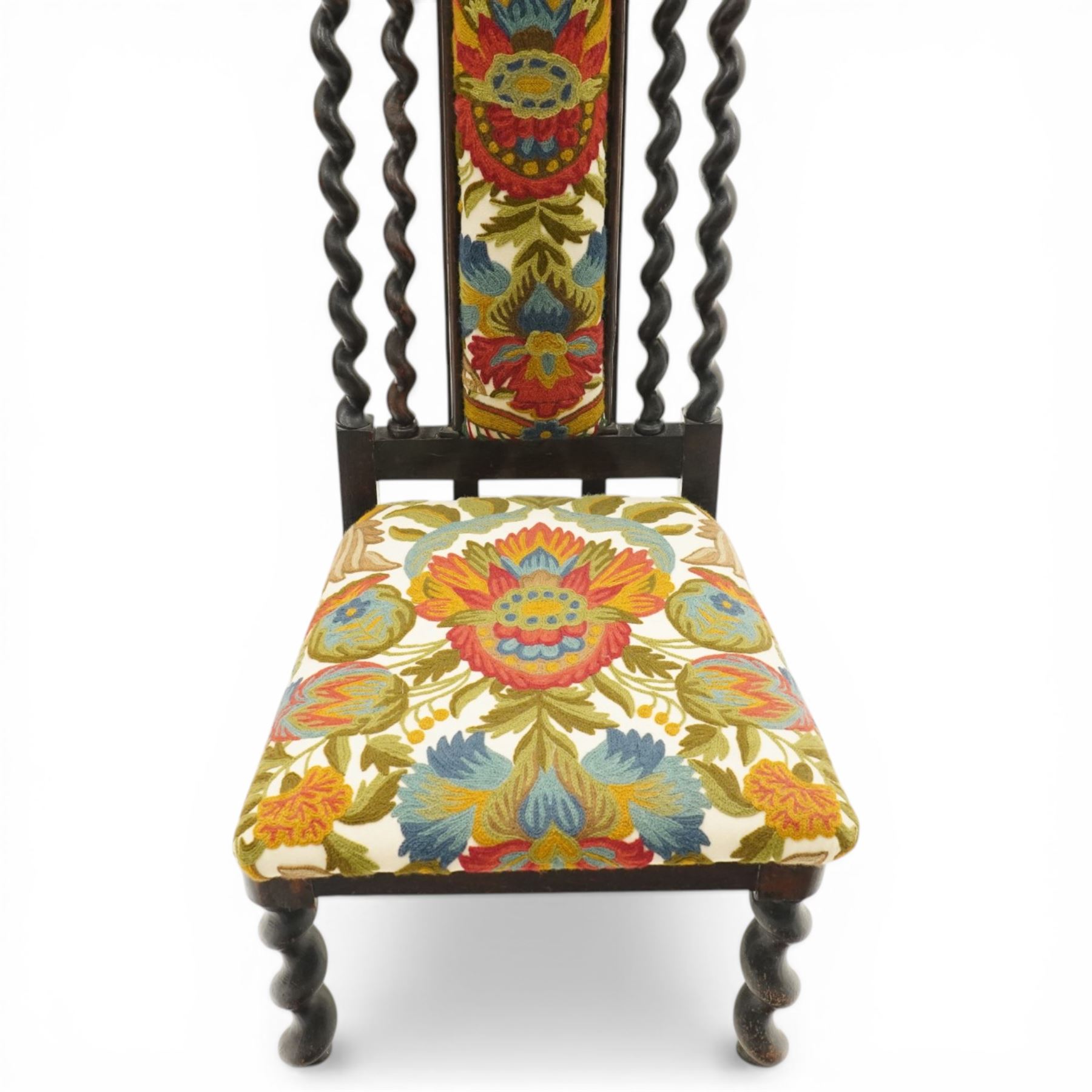 19th century Carolean design oak hall chair, carved cresting rail over barley-twist uprights, high back and loose seat upholstered in wool-work foliate tapestry (W46cm H116cm); 19th century elbow chair mahogany with spiral turned centre rail and roundel-applied frieze (W56cm H85cm)