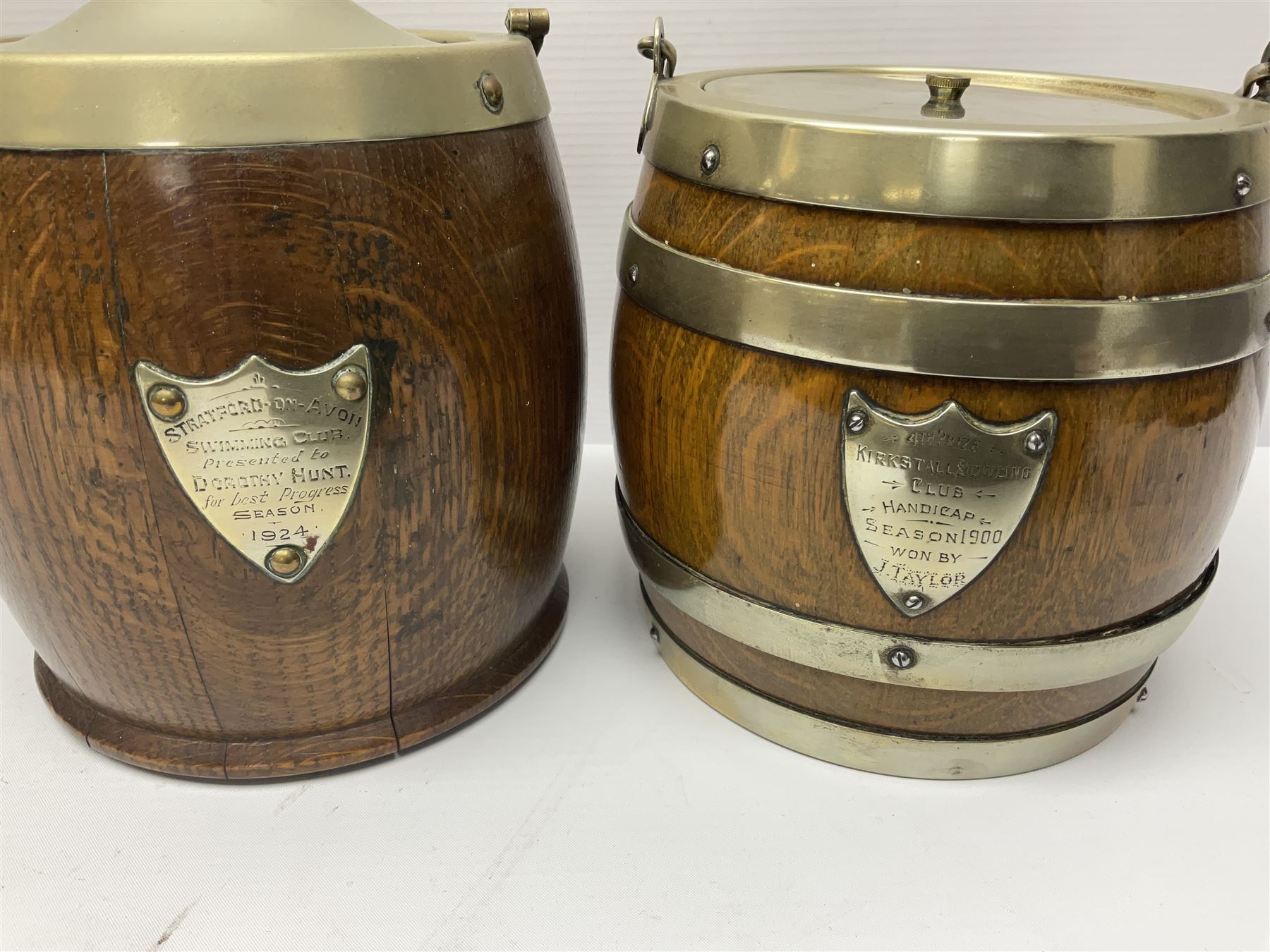 Five early 20th century biscuit barrels with silver-plated mounts, one made from Mahogany from HMS Hindustan
