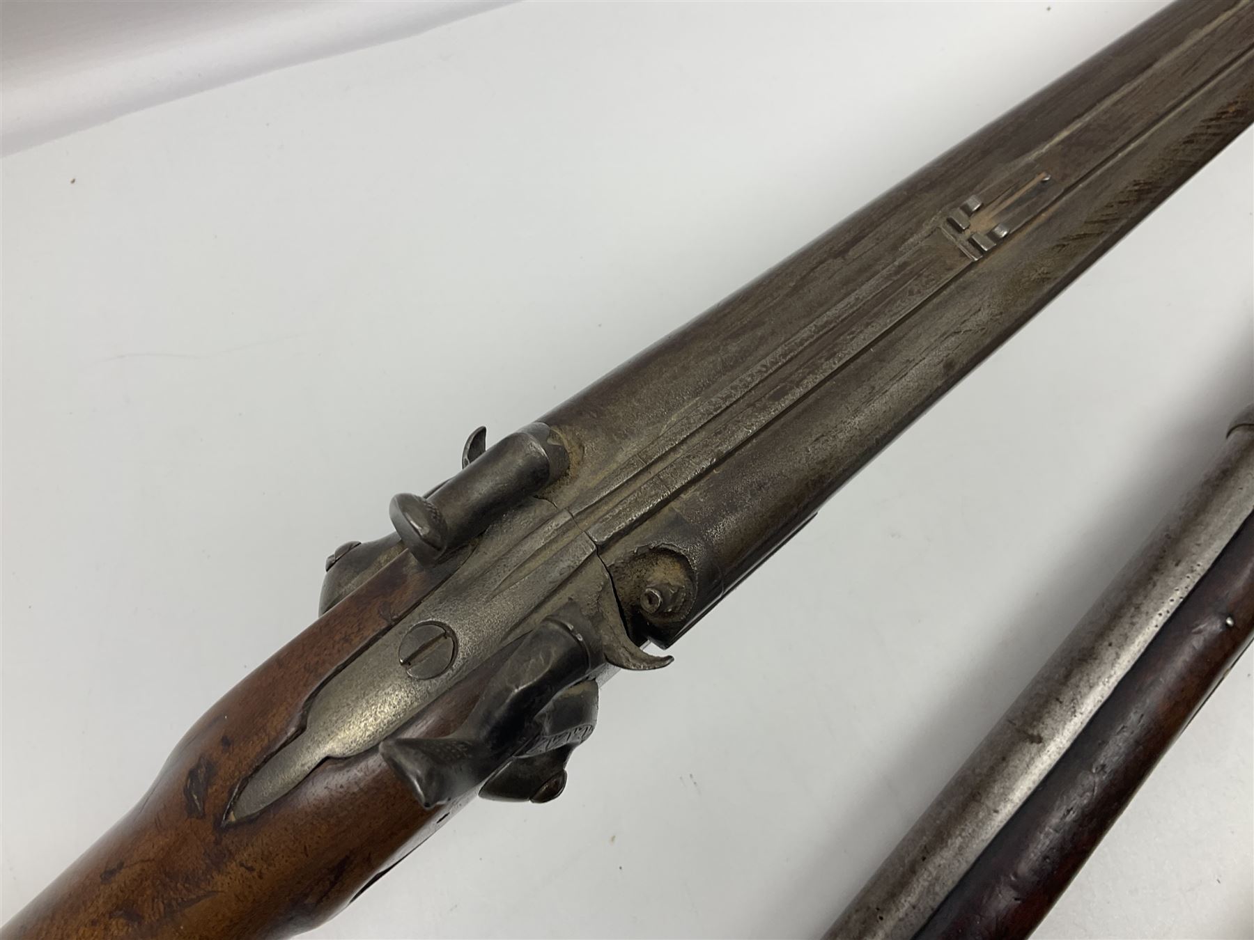 19th century Indian .577 Enfield muzzle loading rifle, proofed for 26-bore, the 98.5cm barrel with three barrel bands and later ram rod L140cm overall; 19th century Belgian side-by-side double barrel percussion shotgun, approximately 20-bore, with 74cm barrels and studded walnut stock, lock plate marked 'Liege 1868' and 'V. Gulikers-Maquinay' L117cm overall; and another side-by-side double barrel shotgun by Smythe with underlever opening (3)