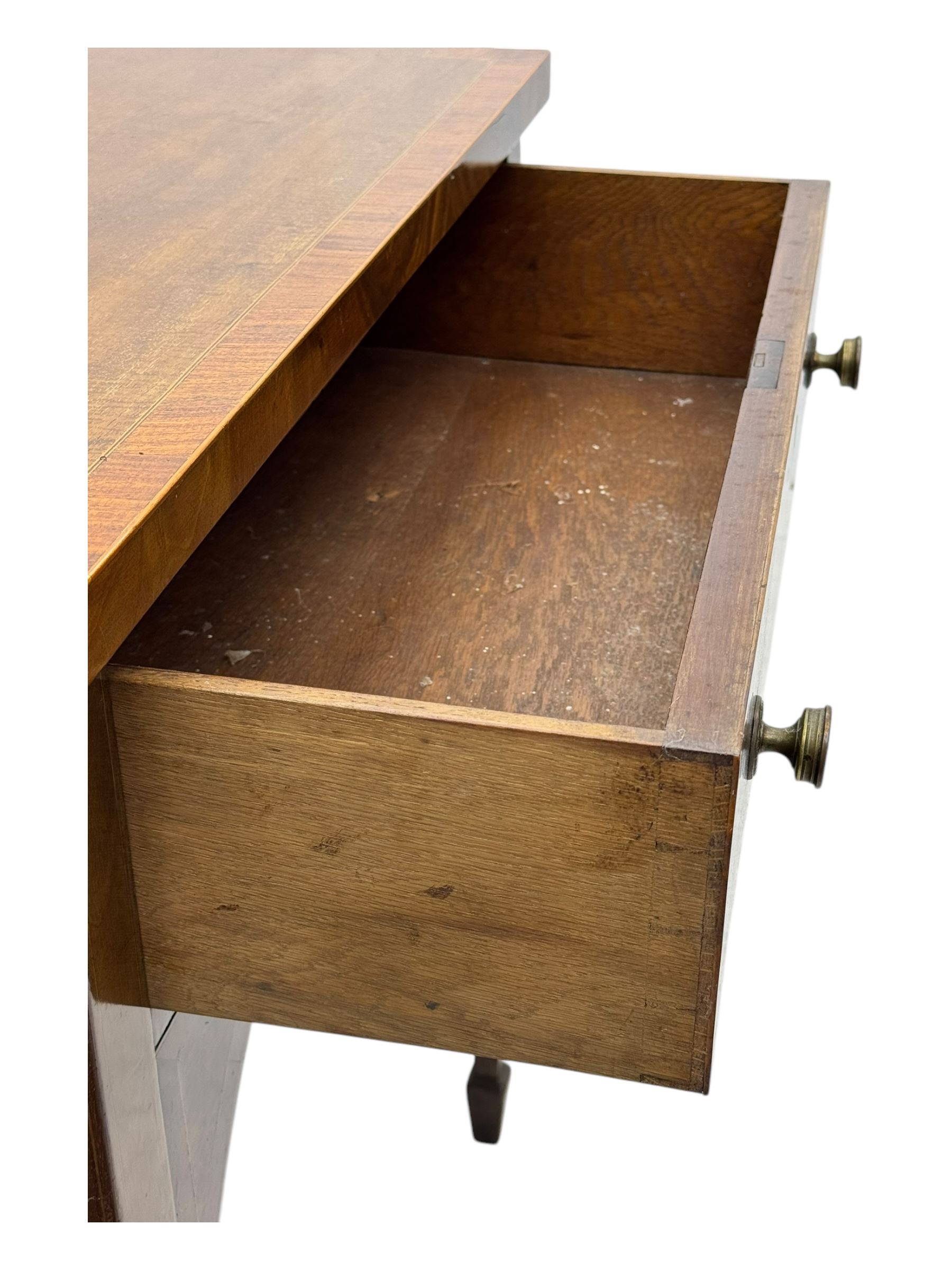 George III mahogany bow-fronted sideboard, serpentine-shaped top with crossbanded and boxwood stringing, over a central drawer flanked by deep cupboards, on square tapering supports terminating in spade feet