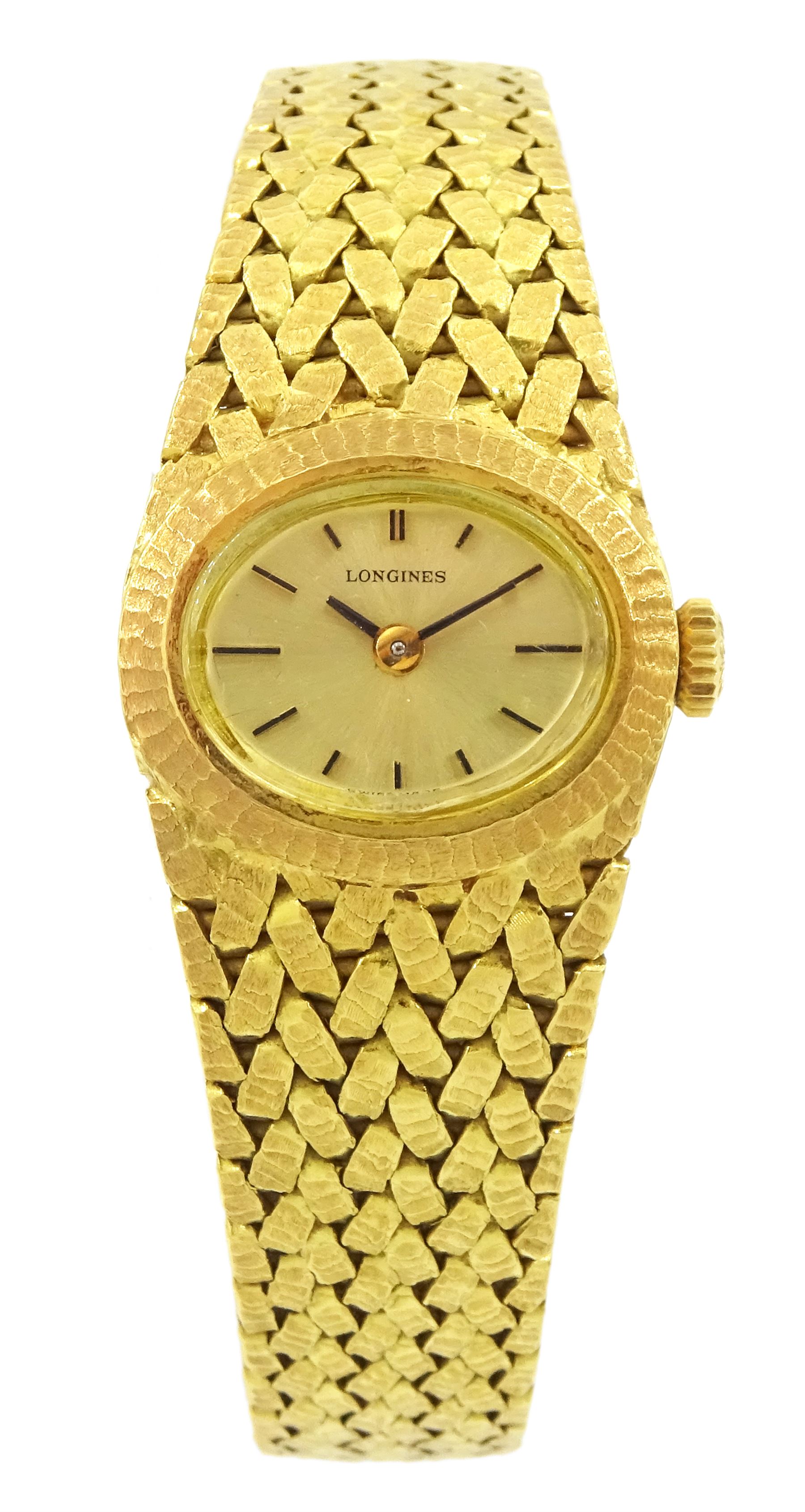 Longines 18ct gold ladies manual wind wristwatch, case No. 40809, Cal. 320, oval champagne dial, with baton hour markers, Helvetia hallmark, on integral 18ct gold textured bracelet, stamped 750