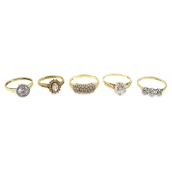  Four 14ct gold cubic zirconia dress rings and a 9ct gold cubic zirconia cluster ring, all hallmarked (5)  