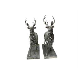 Pair of Composite silvered stags, on rectangular bases, H38cm
