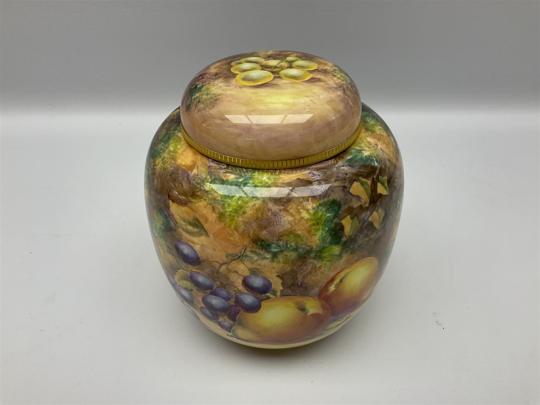 Mid/late 20th century Royal Worcester ginger jar and cover decorated by R Lewis, hand painted with a still life of fruit upon a mossy ground, signed R Lewis, with black printed mark beneath and painted shape number 2826, H17.5cm