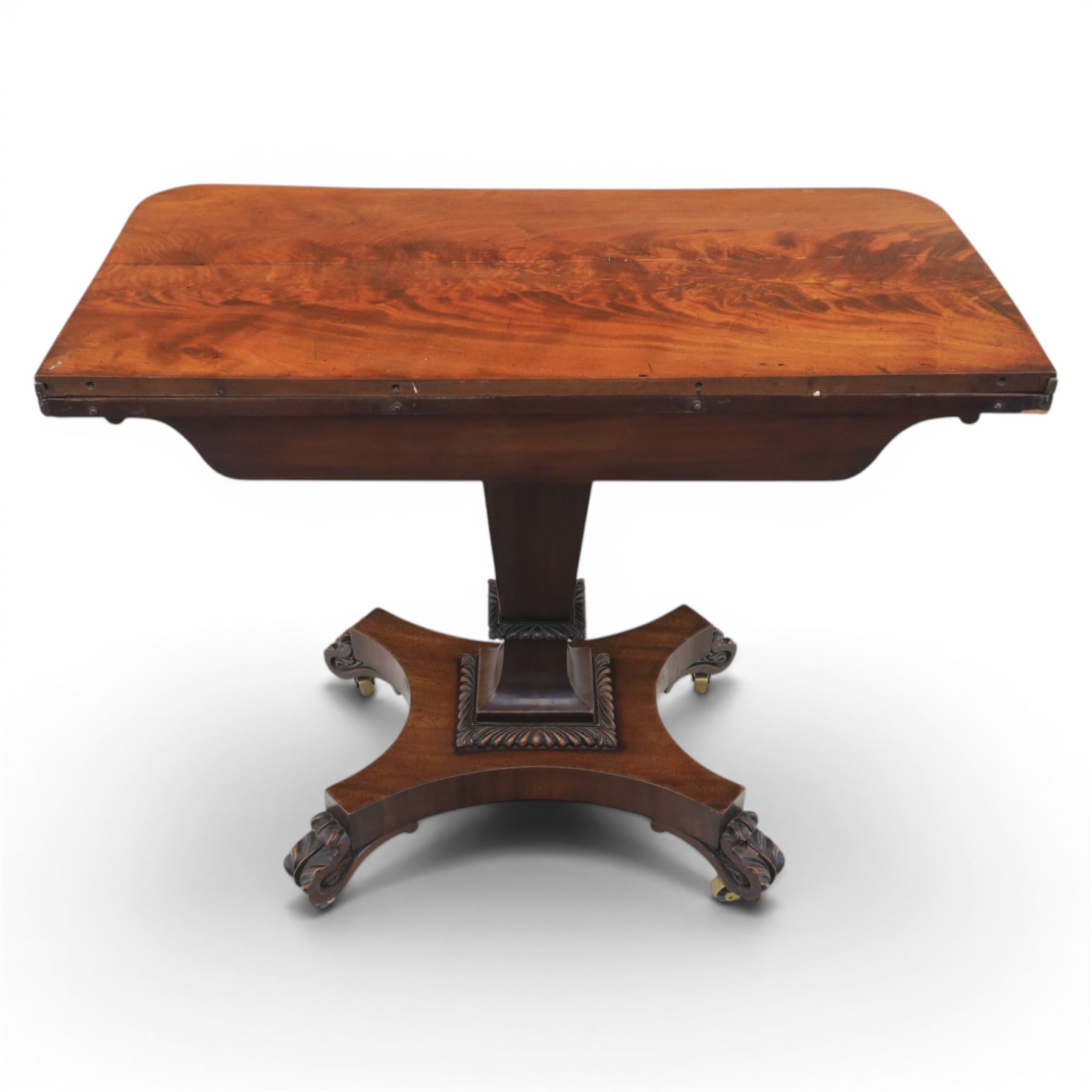 Victorian figured mahogany side table, fold-over swivel extending top, tapering square column above quatrefoil base