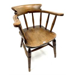 Early 20th century elm smokers bow armchair, turned supports joined by double 'H' stretcher