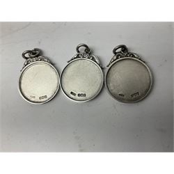 Set of three Yorkshire Miniature Rifle Association hallmarked silver and enamel fob medals, Birmingham 1925, 1926 & 1929; together with six silver plated coffee spoons each engraved with crossed rifles to the terminal (9)