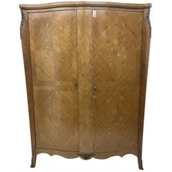 Mid-20th century French Kingwood double wardrobe, shaped front, enclosed by two doors inlaid with flowers, fitted with two drawers and shelves, shaped apron with splayed feet, decorated with ornate cast metal mounts 
