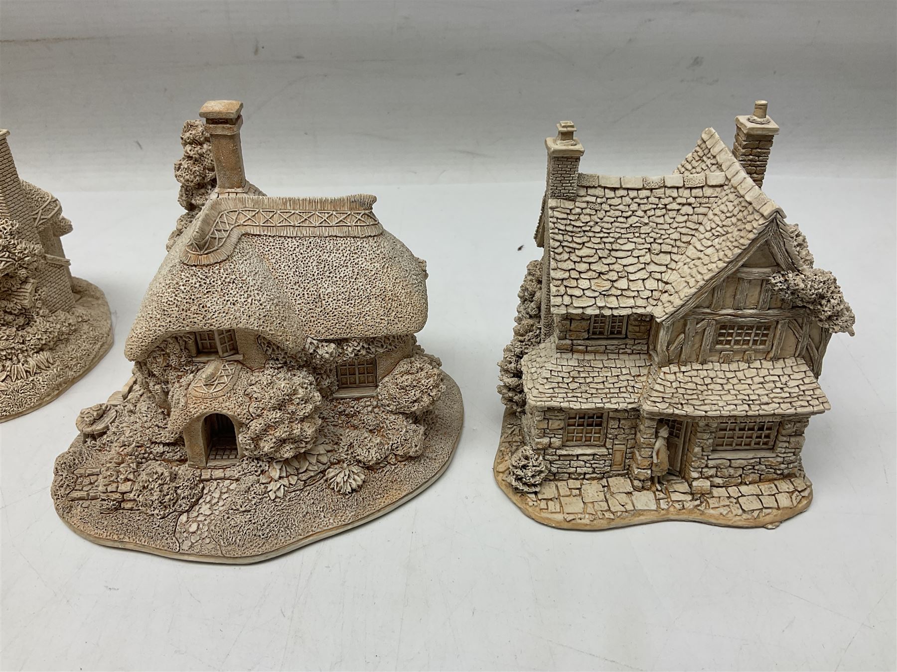 Twenty-three Lilliput Lane models from the Paint Your Own collection, to include Catmint Cottage, Sugar and Spice, Gypsy Cottage, Ruby Cottage and Little Birch, some boxed