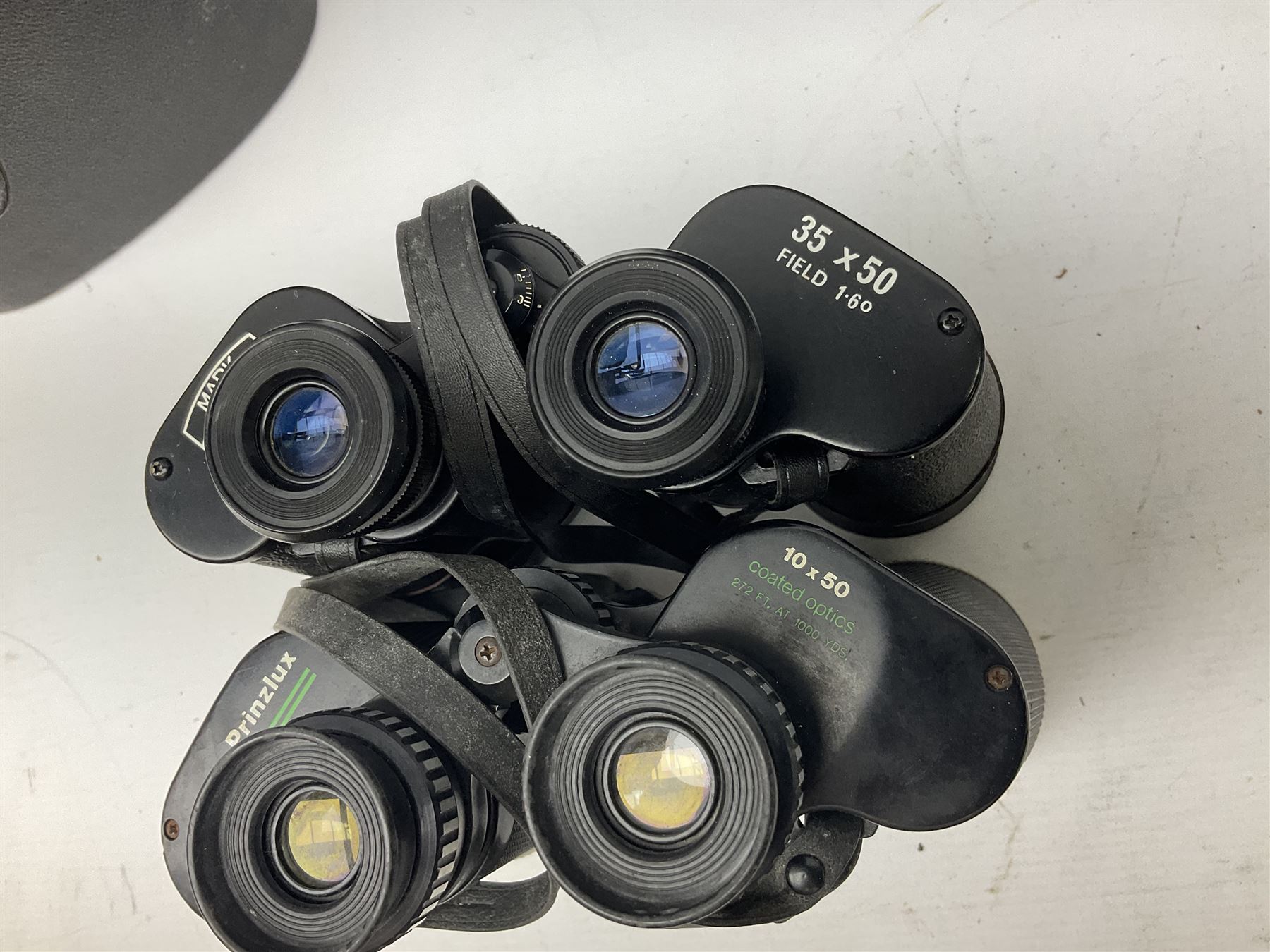 Nine binoculars to include Prinz 10x50, Prinzlux 10x50,  Ellgee Cadet 8x25, Mark Scheffel 35x50 etc, eight with cases