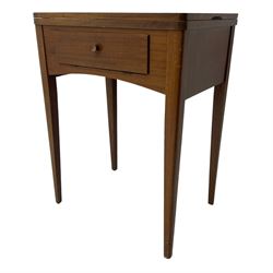 Mid-20th century teak sewing table, rectangular top with hinged fold-out extension revealing built-in Singer sewing machine, fitted with single hinged drawer, on square tapered supports; various Singer accessories to include Fashion Discs and Motor Controller