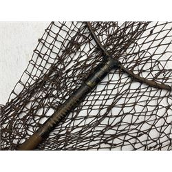 Fishing tackle and accessories housed in two wicker creels, including a landing net, fly tin, small brass reel, other reels to include two Intrepid Boy'o examples, crab lines etc 