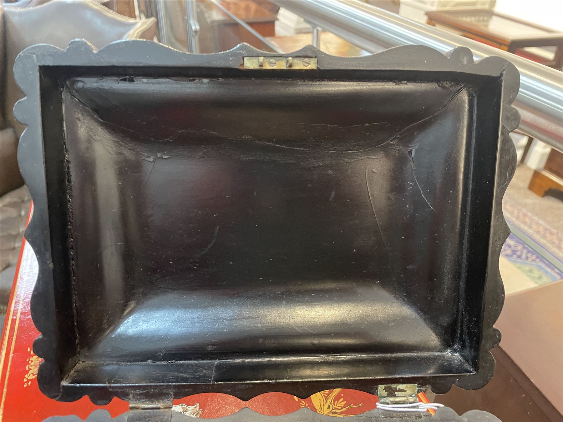 Victorian black lacquered papier-mâché sewing box, of rectangular form with shaped sides, the slightly domed top with inlaid mother of pearl and abalone decoration, the sides with gilt and polychrome painted scrollwork, the hinged cover opening to reveal a fitted interior with lift out tray, H14cm