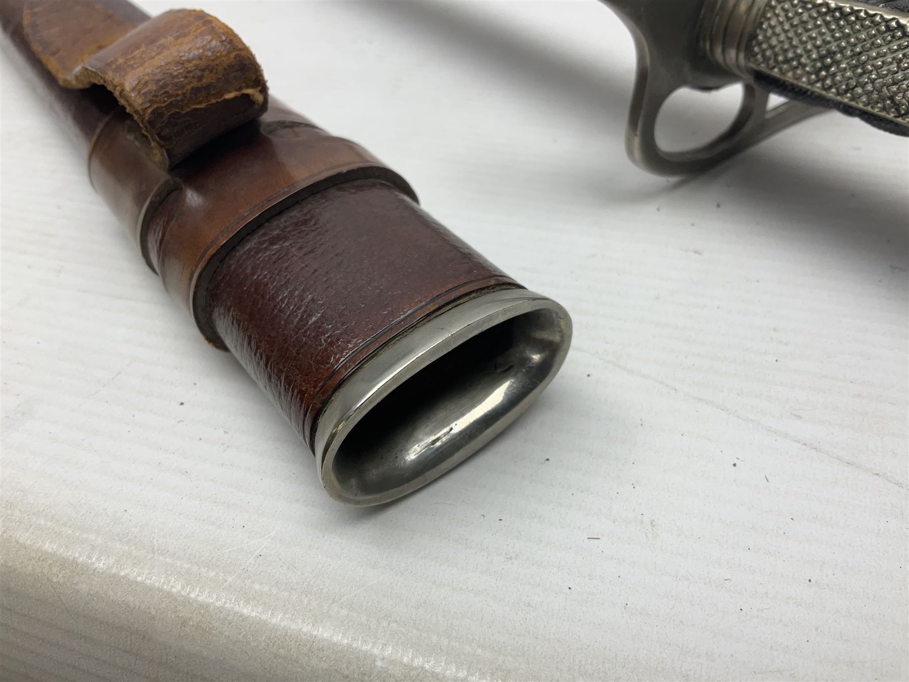 WWI 1821 pattern Royal Artillery officer's sword, the 82.5cm decorative blade by Hawksworth Sheffield etched with GVR cypher and crown, 'Royal Artillery' and field gun between scrolling foliate panels; three-bar hilt with wire-bound fish skin grip and chequered backstrap; in leather covered scabbard L99cm overall