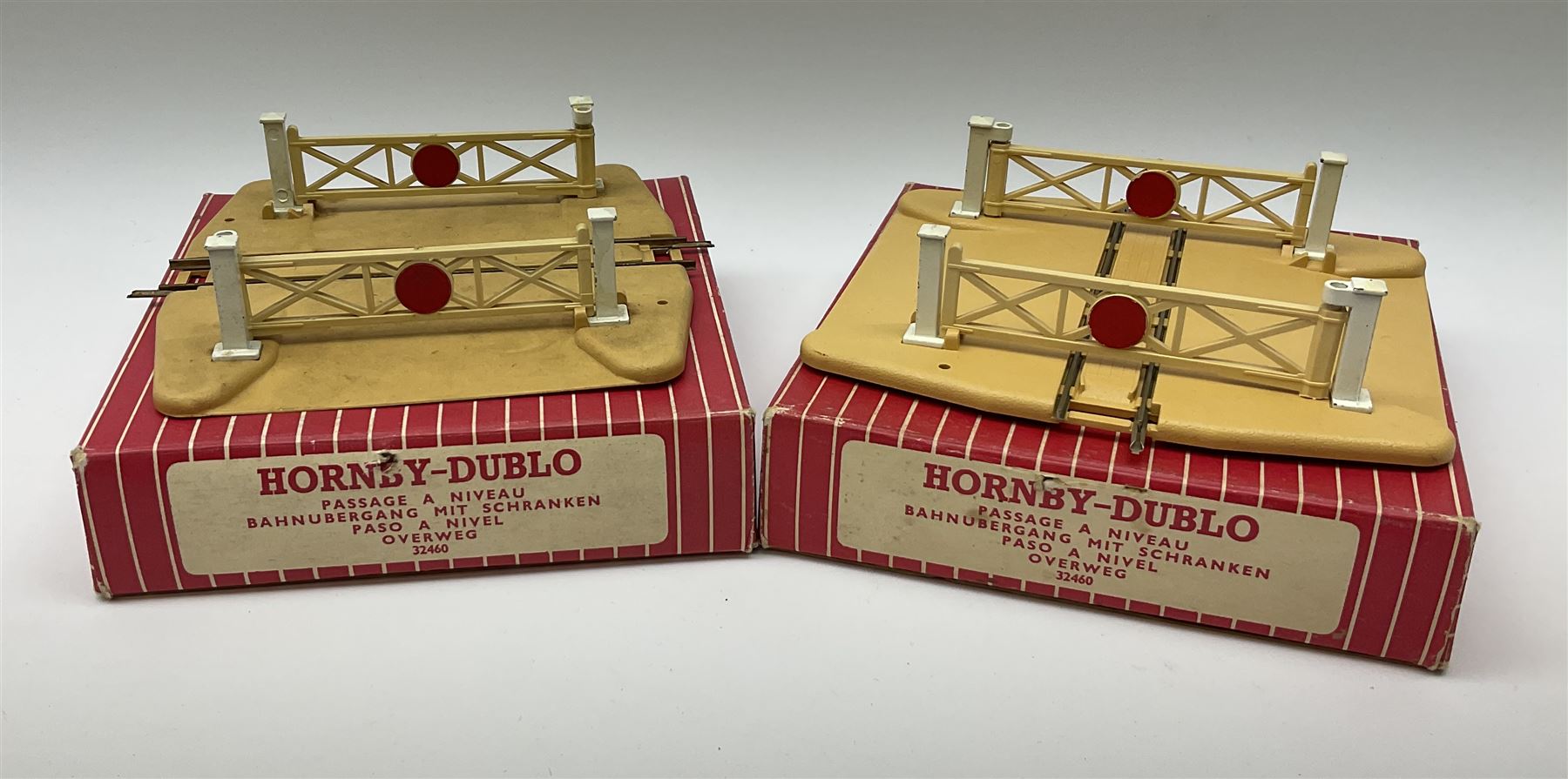 Hornby Dublo - 5080 Signal Cabin with pack of Station Names; two D1 Footbridges, one with instructions; and two 2460 Plastic Level Crossings suitable for two-rail system; 2400 T.P.O. Mail Van Set for two-rail system all boxed; together with three plastic brick effect tunnel mouths for double track layout (9)