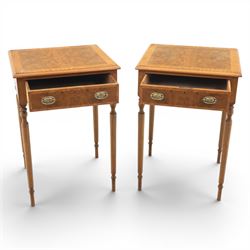 Traditional design pair of walnut lamp tables, figured top with crossbanded edge, above a single frieze drawer with brass oval handles, raised on turned supports