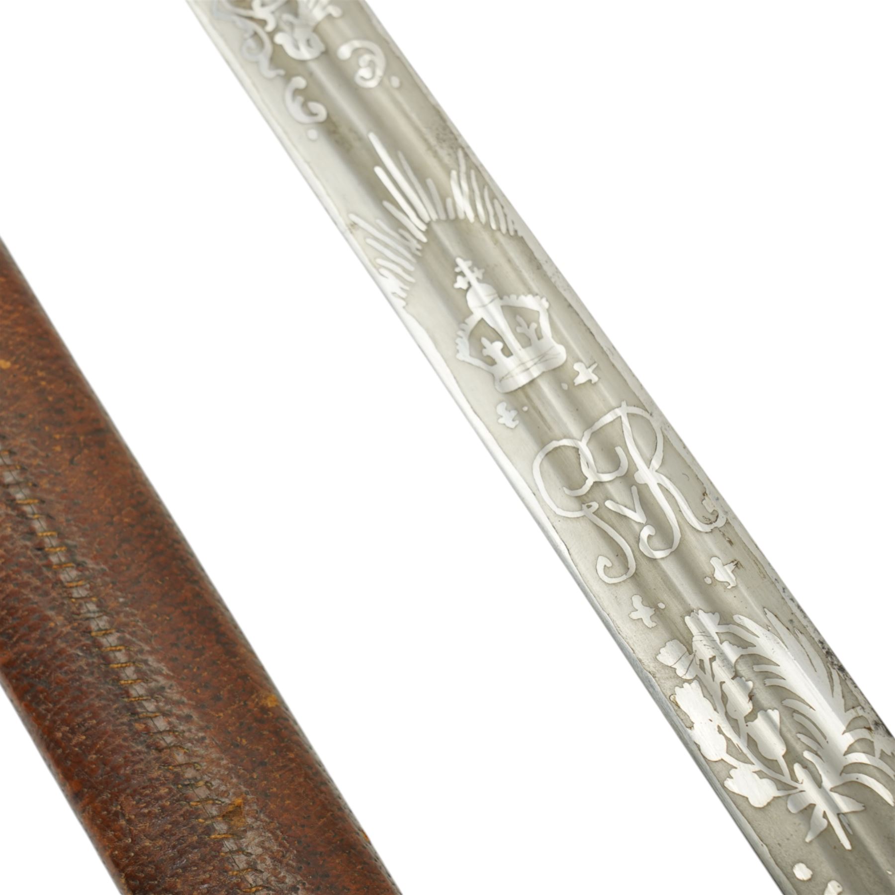 George V basket hilted broad sword with engraved blade, wire wound fish skin grip and field service scabbard, blade length 83cm