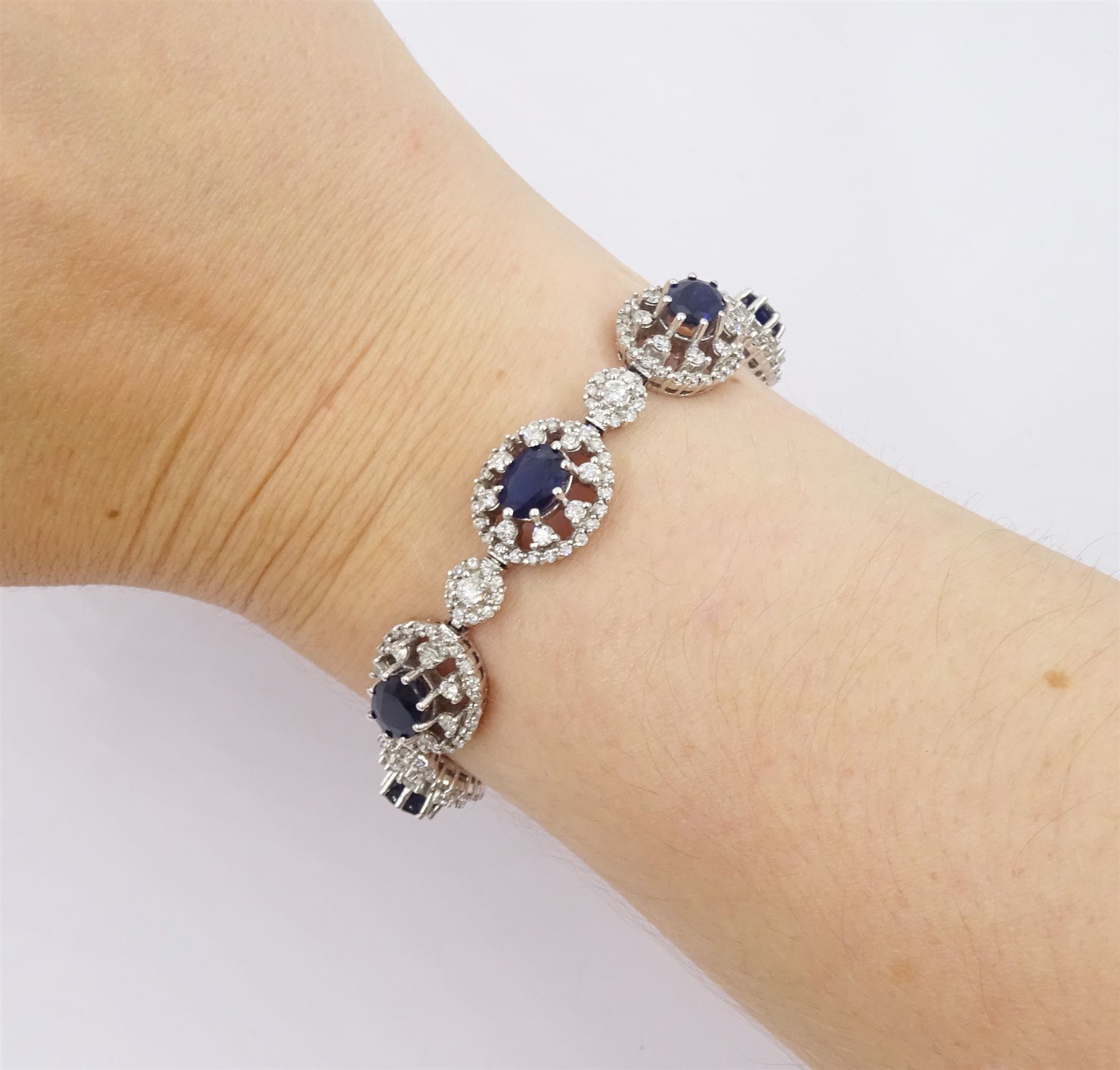 18ct white gold oval cut sapphire and round brilliant cut diamond bracelet, stamped 750, total sapphire weight approx 8.00 carat, total diamond weight approx 3.65 carat