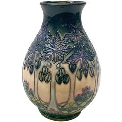 Moorcroft vase, of baluster form, decorated in the Cluny pattern designed by Sally Tuffin, with impressed and painted marks beneath, including date symbol for 1992, H19cm, with maker's box. 