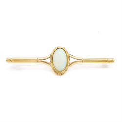 9ct gold opal bar brooch, set with a single oval cabochon cut opal