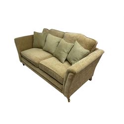 Two seater sofa, upholstered in cream fabric 