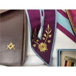 Masonic regalia, including two silver-gilt medals/jewels, centenary medal, aprons, and sash etc, housed in brown briefcase